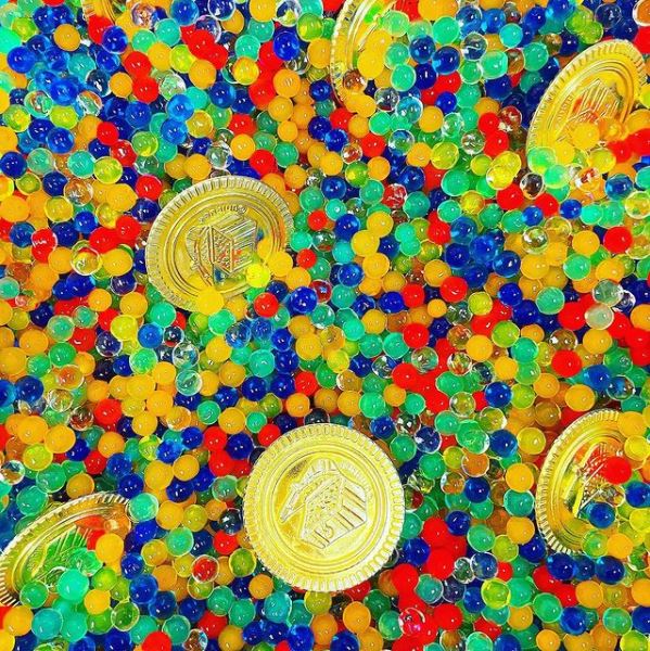 St. Patrick's Day water beads gold coins sensory bin